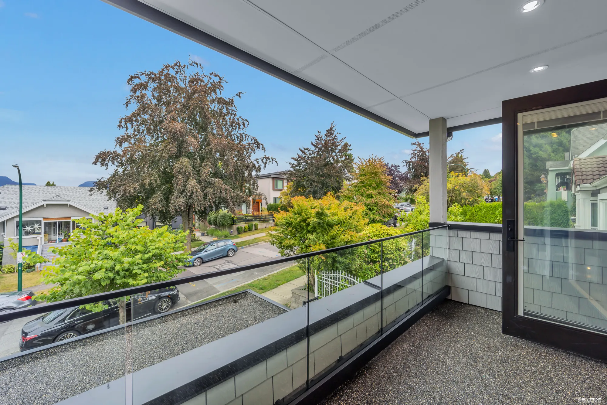 The same balcony seen along its length, with the sliding door at one end
